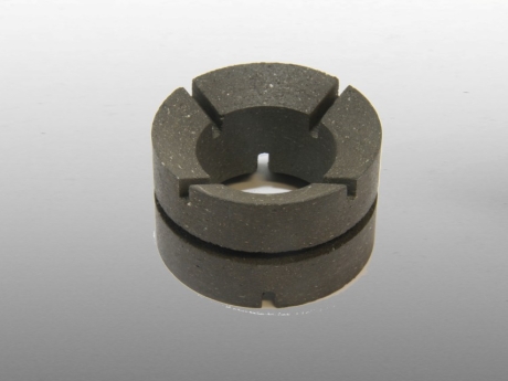 Conical and grooved friction ring
